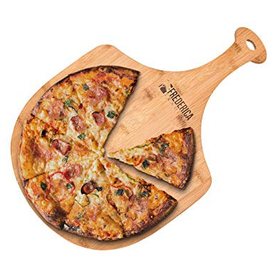 Bamboo pizza peel and cutting board with a pizza on a white background